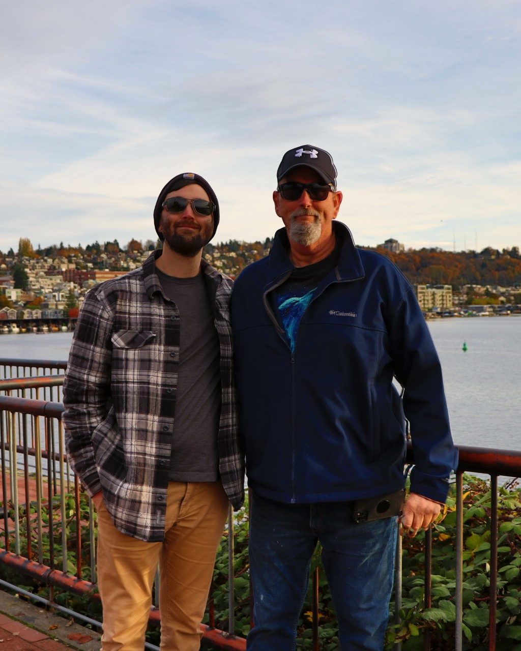 Bob Guiffre and his son, Bobby, standing together at a waterfront railing